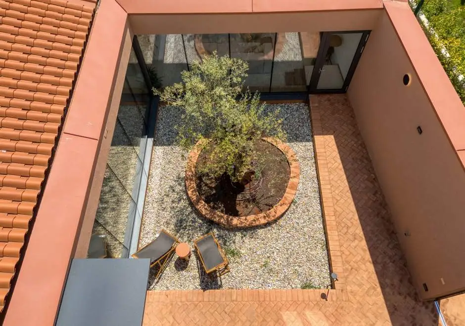 Case Atrio / Casa Nini