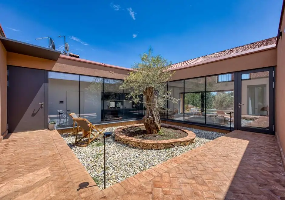 Case Atrio / Casa Nini