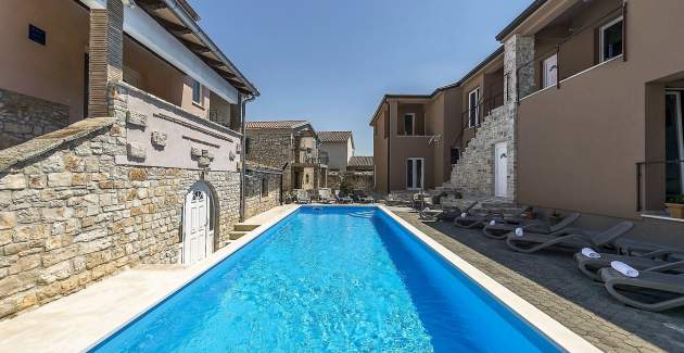 Two-Bedroom Apartment in Villa Valtrazza Noa IV with Balcony and Pool View