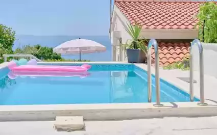 Holiday House Roza with pool and sea view
